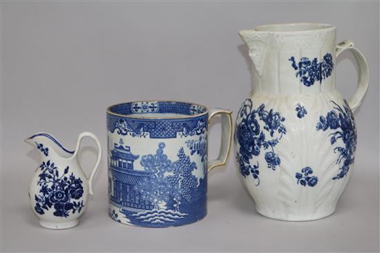 An 18th century Caughley cabbage leaf jug, a Worcester cream jug and a blue and white mug tallest 23cm